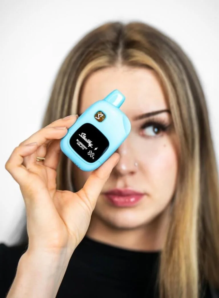 Vertical lifestyle or product image captured on a mobile device showing vape accessories.
